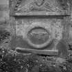 View of gravestone of George Brown, 1730, with winged soul and dividers set-square and axe, in the churchyard of Forteviot Parish Church.