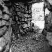 Publication photograph: entrance passage from outside, Torwood Broch.