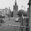 Distant view of Chalmers Memorial Church, Gosford Road, Port Seton, from N along Manse Lane.