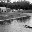 Two photographs showing salmon fishing from coble.
