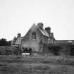 View of house and attached farmsteading, showing the clock tower.