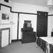 Interior. View of first floor bedroom in Eastt House above the parlour