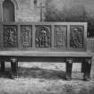 Interior.
View of wooden seat with carved panels.