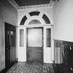 Interior.
View of staircase hall showing storm door.