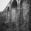 Tarrasfoot Viaduct. Detail of pier and brick voussoirs from SE on SW elevation, SE bank.