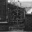Detail of iron gate at N end of building.
