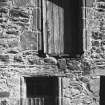 Detail of door and window with moulded jambs.