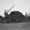 Inverkeithing Bay, Thomas Ward and Sons Shipbreaking Yard, Number 7 Jetty
View from SE of jetty No.7, with two cranes visible behind mounds of salvaged scrap iron