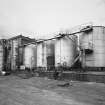 Exterior view from E of old oil tanks