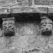 Detail of two corbels on apse