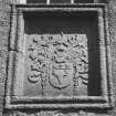 Detail of heraldic panel above main entrance doorway.