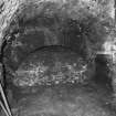 Interior, basement.
View of former kitchen fireplace.
