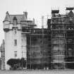 Fyvie Castle.
Detail of South elevation showing Seton Tower during restoration and Meldrum Tower.