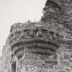Detail of corbelled turret on South-East angle of South range.