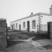 Aberdeen, Greyhope Road, Girdleness Lighthouse.
View of gates to compound and range of building at S end of compound containing dwelling at West end, dated 6 May 1992.