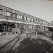 View of N block's S elevation from near W end of central walkway.