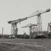 General view from NE of cranes, with giant cantilever crane (left), built by Sir William Arrol & Co in 1907.  150-ton capacity, uprated to 200-tons in 1937.  Photosurvey 19-FEB-1991