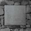 Detail of reverse of stone in W wall of front garden inscribed " ENJA CAME HERE IN THE GUISE OF A CYCLOPS IX 93"
