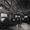 Photographic copy of Interior view in Propulsive Department. Sporting Powder Solvent Recovery Drums