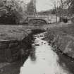 Glasgow, Castlemilk House, Bridge.
General view of bridge and water course from North.