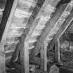Interior.
View of rafters and triangular ashlar pieces at base, E wing roof.