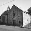 View of mill from NW, showing N side of mill with kiln visible.