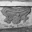 South doorway porch, carved panel (depicting an angel) below seat, detail