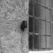Exterior, detail of window shutter hook.