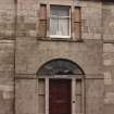 Detail of front entrance and first floor window.