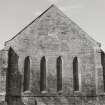 Fearn Abbey.  View of East gable showing four lancets and blocked venetian window in apex.