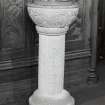 Interior. Detail of carved stone font