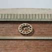 Detail of clock on 1930's brick building