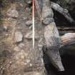 Excavation photograph : stone lining of pit?