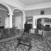 Interior.
View of first floor drawing room from W showing the ionic arcade and archway to the library.