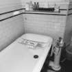 Interior.
Detail of first floor bathroom showing bath and taps.