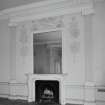 Interior.
First floor drawing room detail of fireplace, giant order Ionic pilasters and plaster cartouches.
