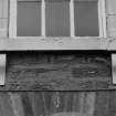 South frontage, detail of first floor carved window cill.