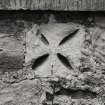 Detail of Romanesque fragments built into wall.