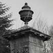 Detail of lidded urn on top of gate pier