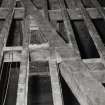 Interior.
Detail of floor timbers showing diagonal bracing.