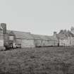 Scar Steading: General view showing boiler house, threshing mill, granary and house from W