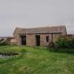 View of garden outbuilding from W