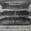 Interior.
View of auditorium from stage with seat numbers added.