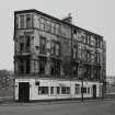 Glasgow, 382 North Woodside Road.
General view from South of public house with flats above in state of disrepair.