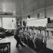 Interior-general view of signal box with signalman operating levers