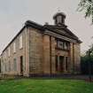 View from W showing entrance and N front