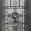 Interior. Detail of gallery stained glass window with flowers