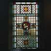 Interior. Detail of gallery stained glass window with flowers