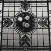 Interior. Detail of gallery stained glass window with pomegranates