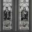 Interior. Detail of chancel stained glass windows in memoory of Archibald Finnie of Springhill and of Archibald Finnie of Kilmarnock